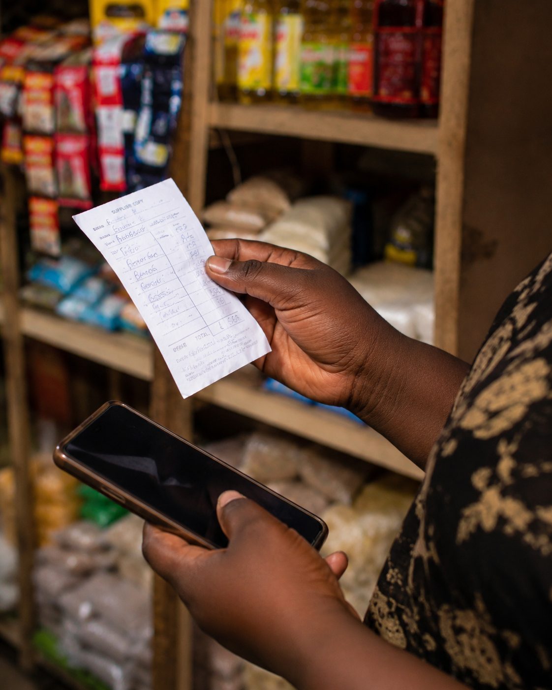 A supplier receipt, phone in hand